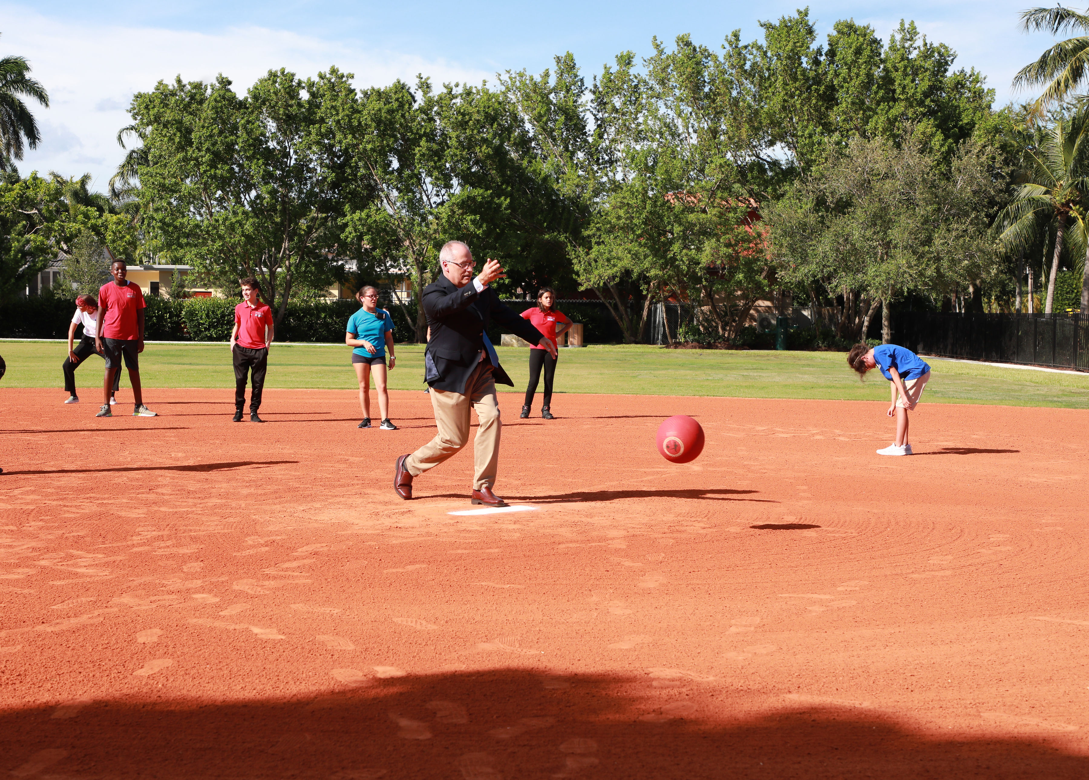 Mayor Gelber playing kickball with the school kids.